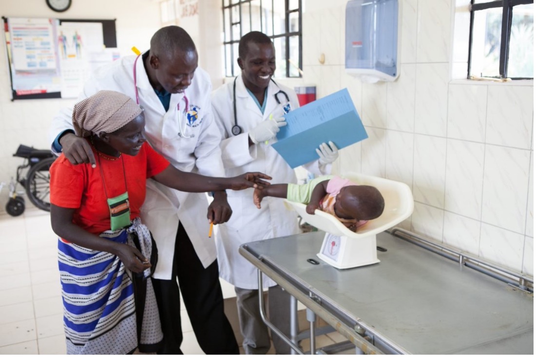 a doctor helping a young child